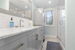 Another stunning full bathroom on the first level